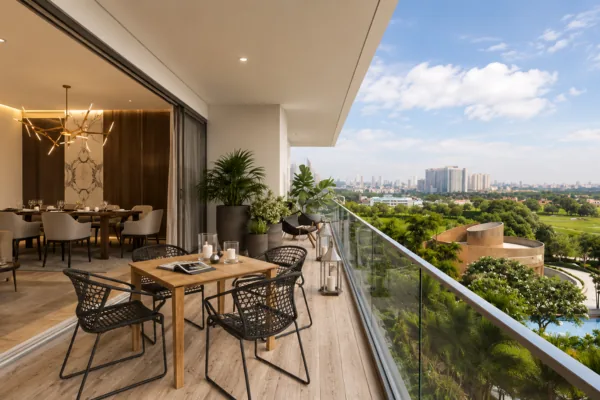Furnished golf-view balcony with dining at Kalpataru Vista Sector 128 Noida