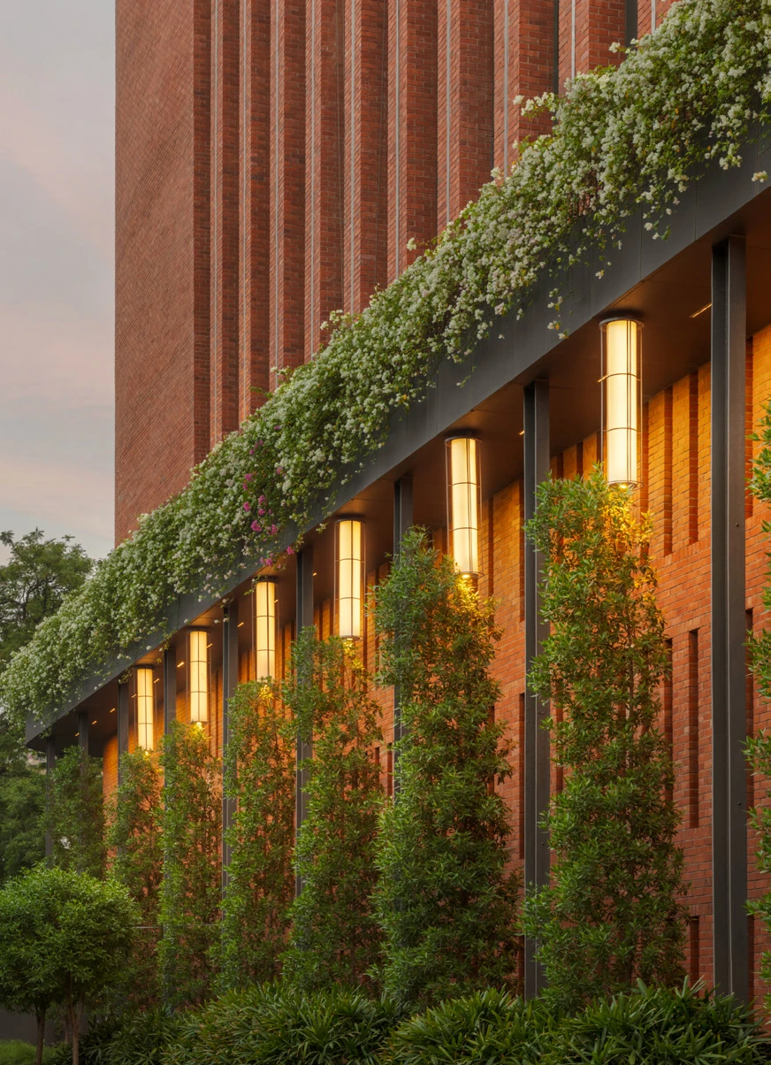Landscaped green facade and walkways at Max One Noida campus Sector 16B