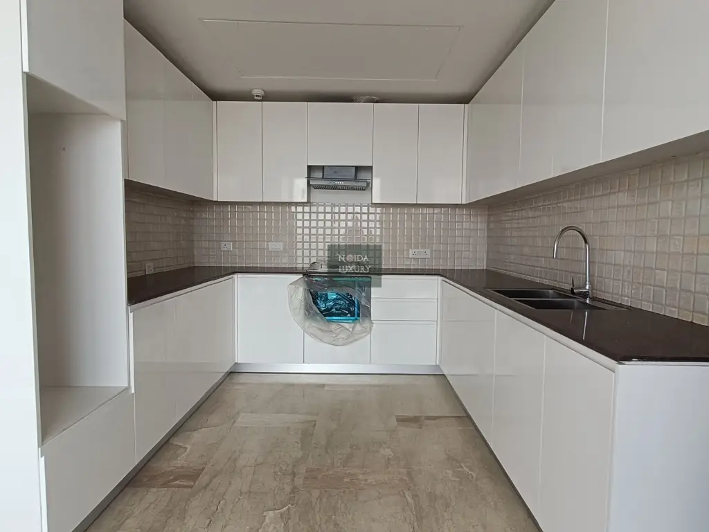 Modern modular kitchen in 4 BHK penthouse at Nova Residences Supertech Supernova Noida