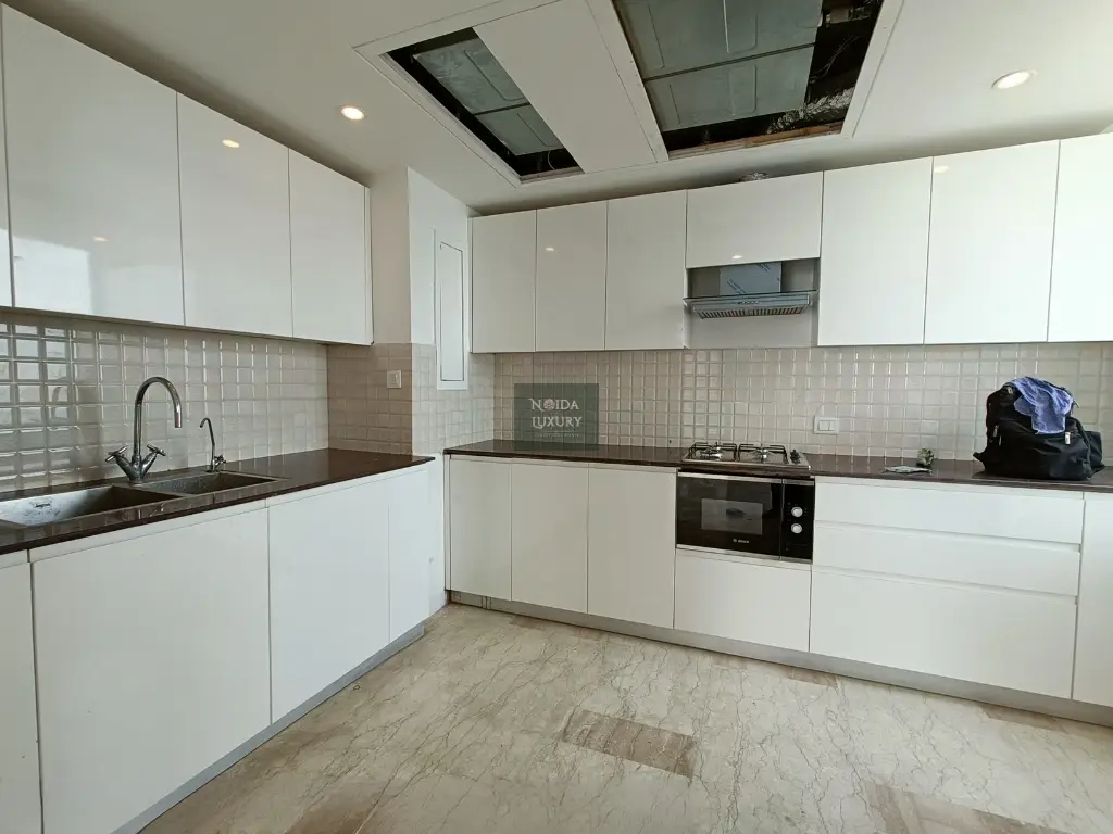 Luxury penthouse for sale in Noida — premium layout with modular kitchen and wooden flooring