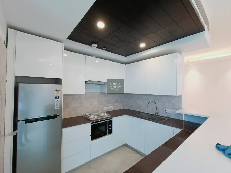 2 BHK flat for sale in Nova East Sector 94 Noida — well-lit apartment with pool, gym and child play area